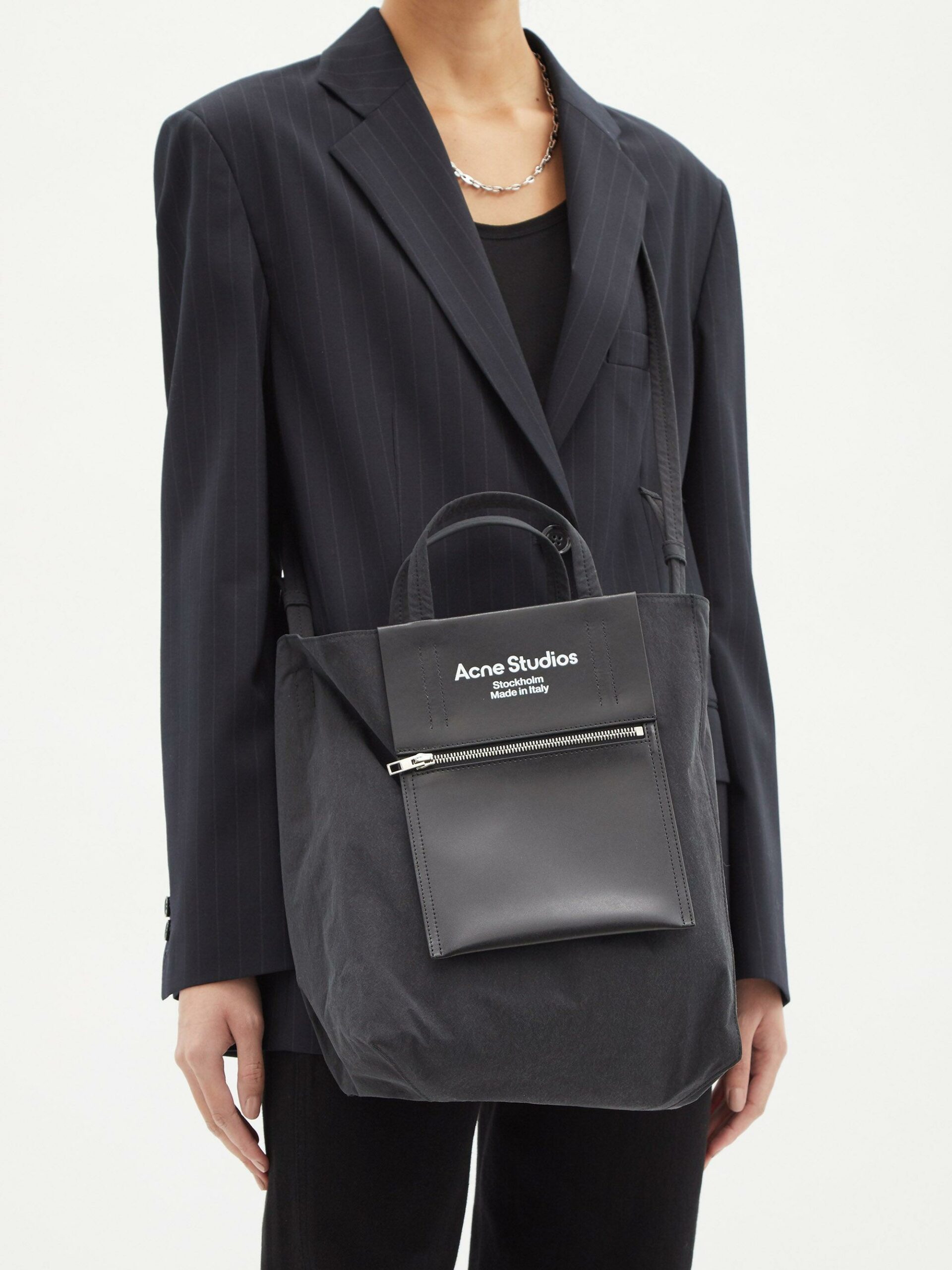 the agele medium leather-trim tote by acne studios